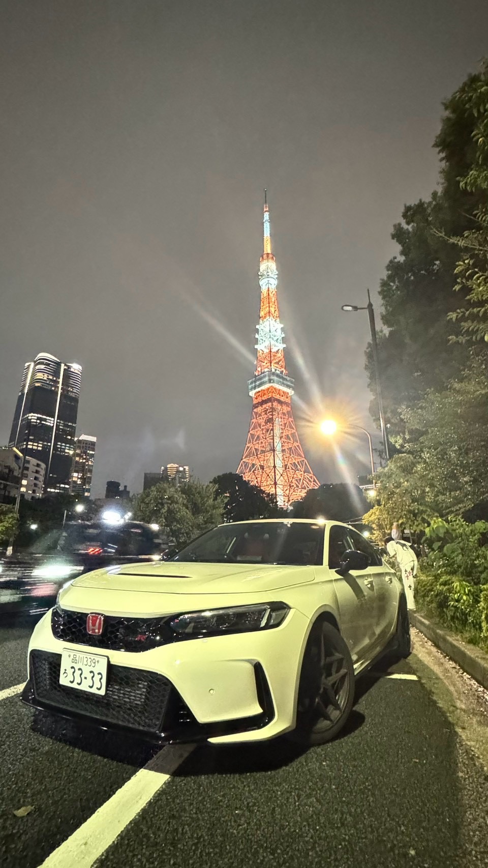White Honda Civic Type R beneath Tokyo Tower at night